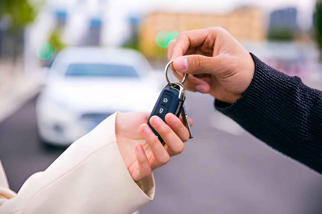 Car Key Replacement 6 Car key replacement technician holding a newly cut key in Springfield