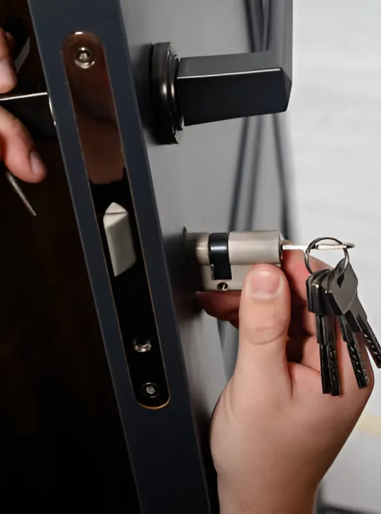 Professional locksmith unlocking car door during emergency service in Springfield
