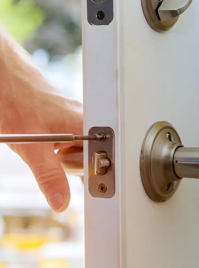 Commercial Lock Installation Nixa Locksmith in Nixa installing high-security commercial lock for local business